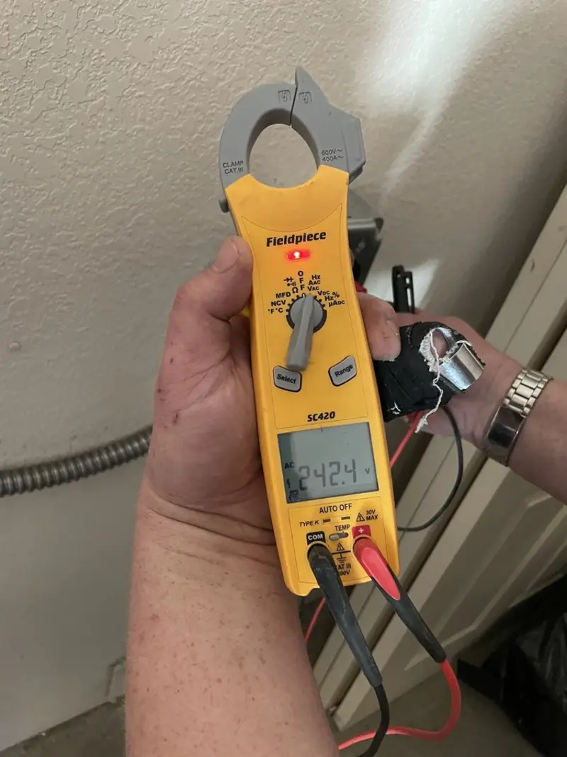 Voltage testing with clamp meter during Recessed Lighting Installation in Warwick